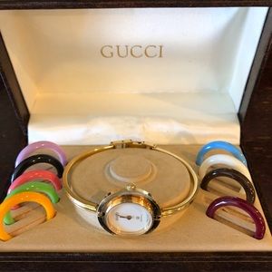 Vintage Gucci watch with interchangeable bezels .